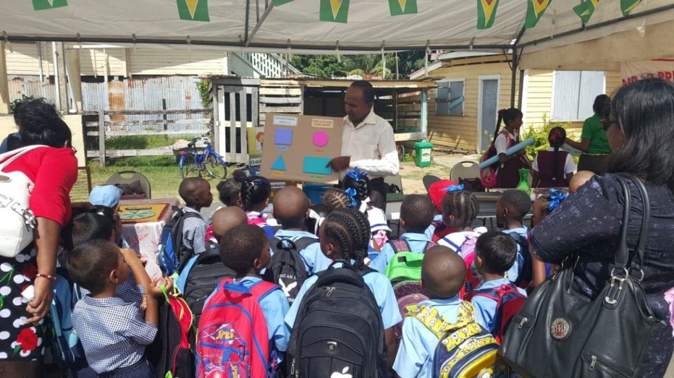 Pupils paying keen attention to what was being taught by a teacher at a Numeracy and Literacy fair held at the Rose Hall Town Primary School last Monday.  The objective of the fair was to build, display and demonstrate materials that can be used to promote literacy and numeracy in classrooms.