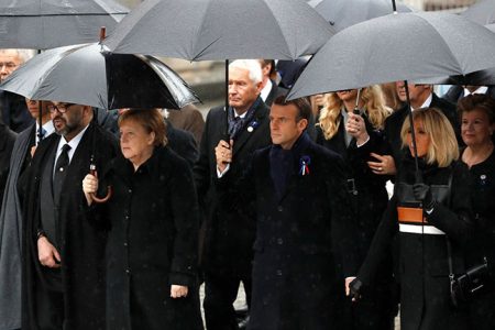 French President Emmanuel Macron, his wife Brigitte and German Chancellor Angela Merkel with other heads of states and governments arrive to attend a commemoration ceremony for Armistice Day, 100 years after the end of World War One, at the Arc de Triomphe, in Paris, France, November 11, 2018. REUTERS/Yves Herman
