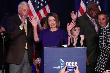 U.S. House Minority Leader Nancy Pelosi celebrates the Democrats winning a majority in the U.S. House of Representatives with House Minority Whip Steny Hoyer (L), her grandson Paul (3rd R), U.S. Rep. James Clyburn (2nd R) and Democratic Congressional Campaign Committee (DCCC) Chairman Ben Ray Lujan (R) during a Democratic midterm election night party in Washington, U.S. November 6, 2018. REUTERS/Jonathan Ernst