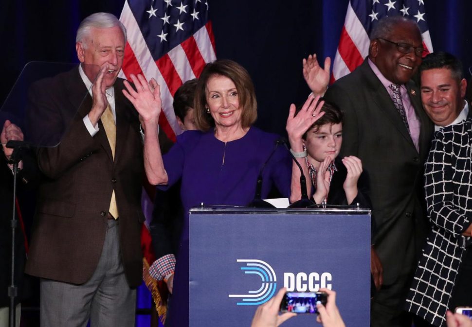 U.S. House Minority Leader Nancy Pelosi celebrates the Democrats winning a majority in the U.S. House of Representatives with House Minority Whip Steny Hoyer (L), her grandson Paul (3rd R), U.S. Rep. James Clyburn (2nd R) and Democratic Congressional Campaign Committee (DCCC) Chairman Ben Ray Lujan (R) during a Democratic midterm election night party in Washington, U.S. November 6, 2018. REUTERS/Jonathan Ernst