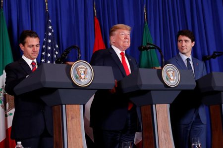 U.S. President Donald Trump (centre), Canada’s Prime Minister Justin Trudeau (right)  and Mexico’s President Enrique Pena Nieto attend the USMCA signing ceremony before the G20 leaders summit in Buenos Aires, Argentina November 30, 2018. REUTERS/Kevin Lamarque