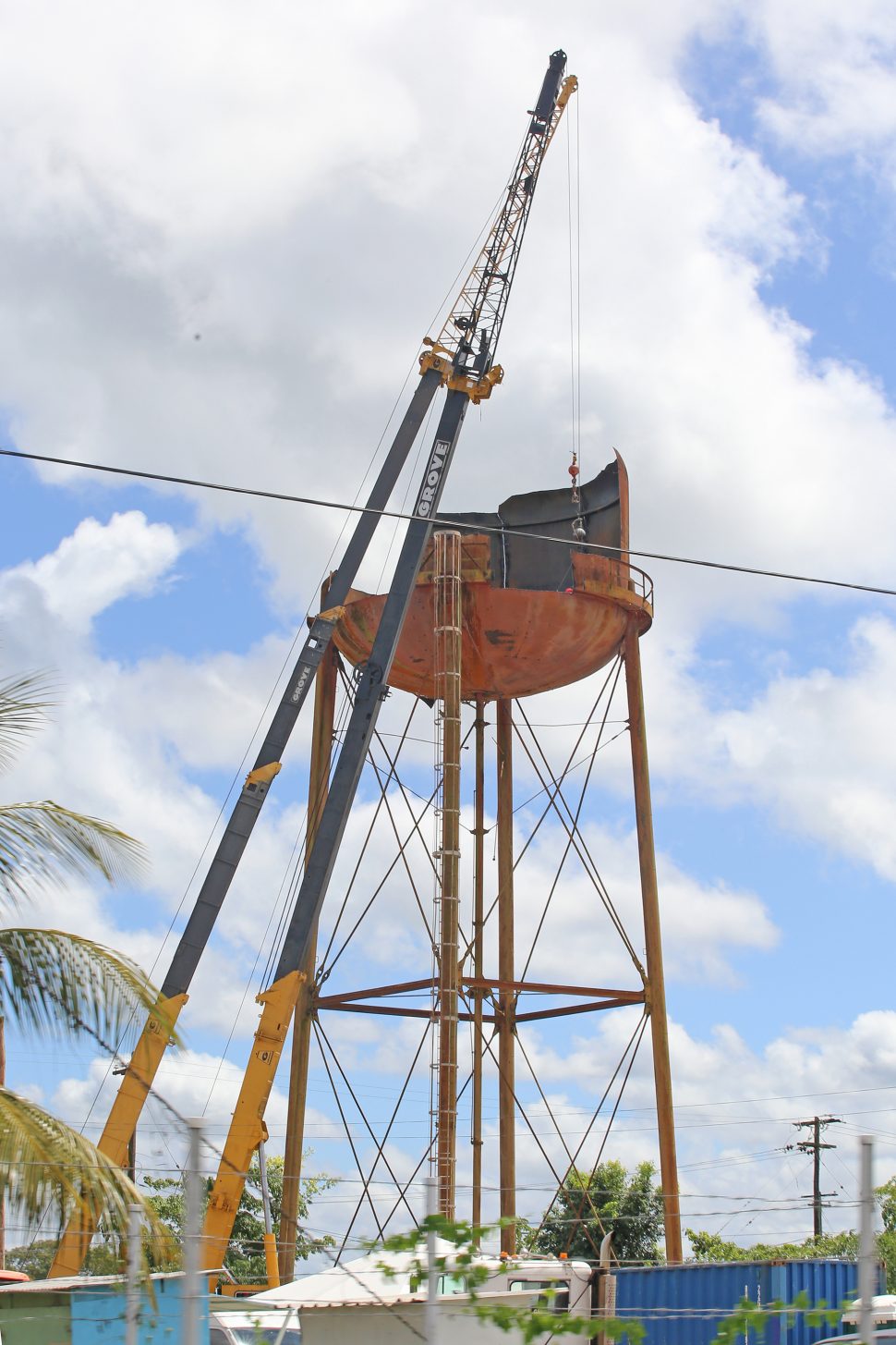 This aged water storage tank at Last Street, Herstelling, East Bank Demerara was being cut apart on Monday morning.  