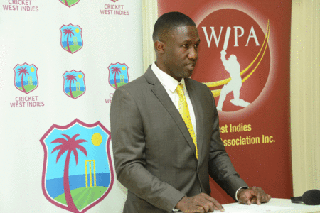 WIPA president and chief executive officer, Wavell Hinds, speaking at the handing-over ceremony of health insurance cards to Jamaica Scorpions players. 