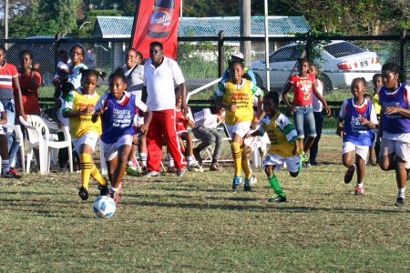 Scenes from the Smith Memorial and St. Pius clash in the Smalta Girls Pee Wee Football Championship at the Ministry of Education ground, Carifesta Avenue.