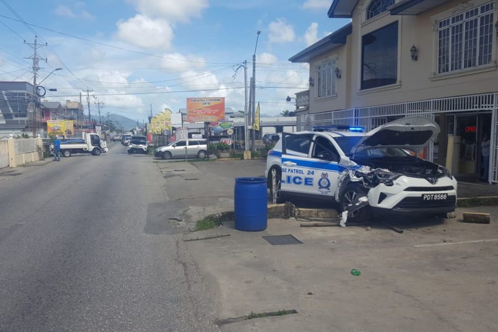 The scene of the accident involving two police SUVs and a panel van along the Southern Main Road in Chin Chin, Cunupia, yesterday.