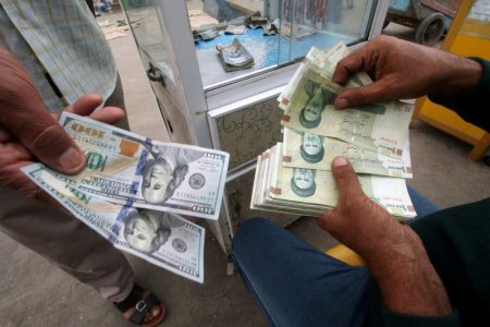 Iranian rials, U.S. dollars and Iraqi dinars are seen at a currency exchange shop in Basra, Iraq November 3, 2018. Picture taken November 3, 2018. REUTERS/Essam al-Sudani