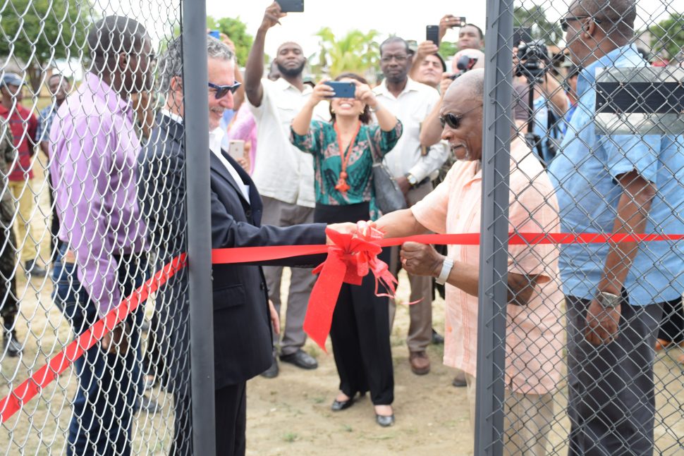 Minister of Foreign Affairs, Carl Greenidge [right] and Ambassador of Brazil to Guyana, Lineu Pupo de Paula cut the ribbon to officially hand over the wells. (DPI photo)