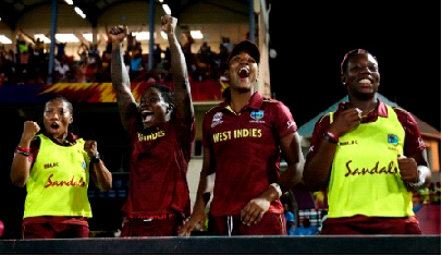 West Indies players celebrate one of their four victories during the preliminary round. 