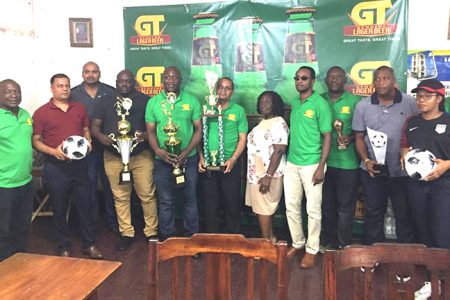 Mayor of New Amsterdam, Winifred Haywood [centre] posing with the tournament organizers and representatives of Banks DIH Limited and other sponsors at the launch on Friday of the second annual GT-Beer 8-aside Football Championship