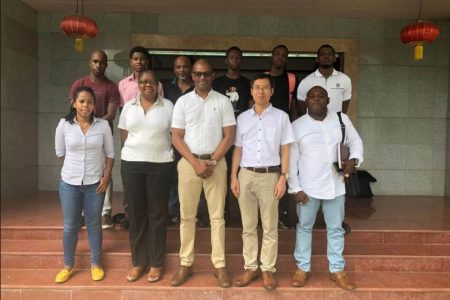 Players and members of the GTTA along with Charge d’Affaires,  Chen Xillai (second from right in front row) at the conclusion of a recent meeting 
