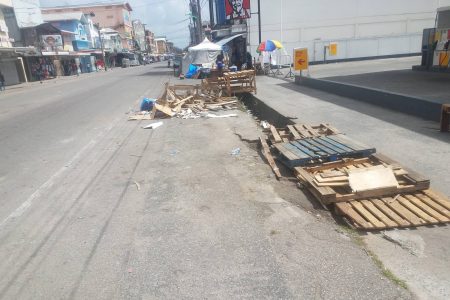 Debris from what appears to be a broken makeshift stand along Regent Street yesterday. 