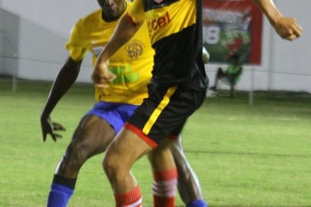 Action in the Annai (in black and yellow) and Shiva Boys Hindu College clash in the KFC Goodwill Football Championship at the Ministry of Education ground, Carifesta Avenue last evening. (Orlando Charles photo)  See page 29