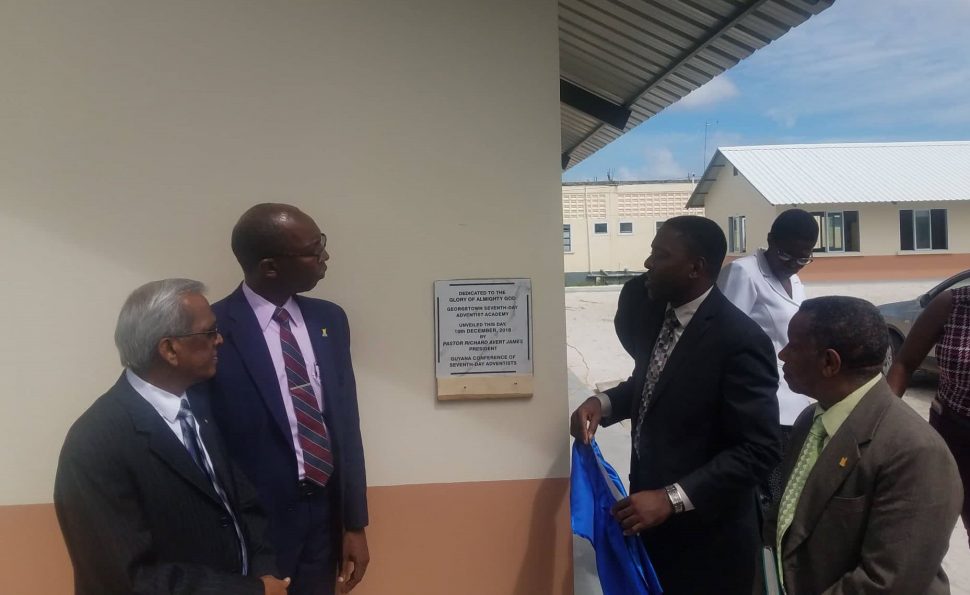 From left are Dr Hilary Bowman; President of the Guyana Conference of Seventh Day Adventists, Richard James; Pastor Exton Clarke and Elder Michael Kendall after the cornerstone for the academy was unveiled.
