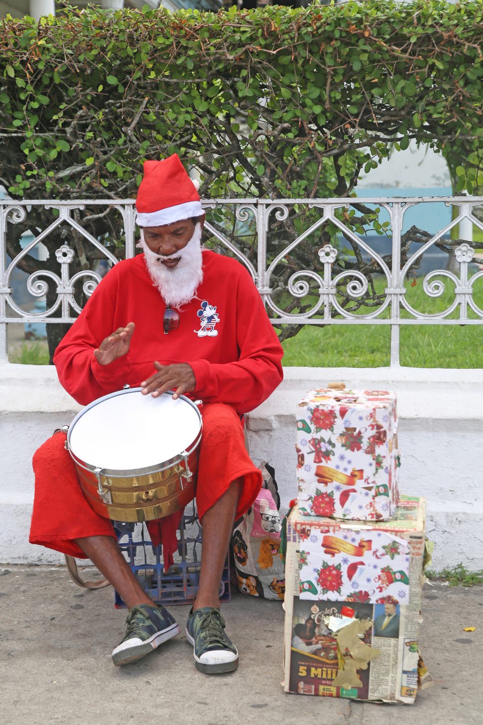 Lone drummer: This drumming Santa was creating his own rhythm on Avenue of the Republic yesterday.
