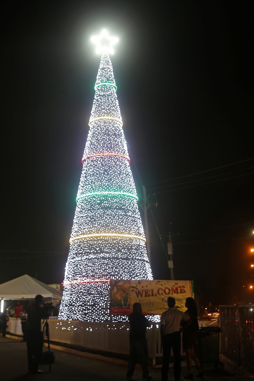 The Christmas season was ushered in at Rahaman’s Park, Houston last evening with the lighting of this 64-ft tall Christmas tree. (Terrence Thompson photo) 