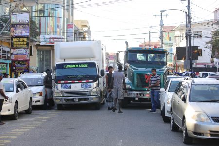  These trucks parked parallel to each other in Robb Street yesterday creating a traffic jam.