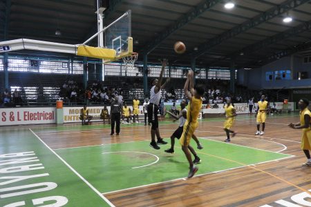Action in the Mackenzie High and St Roses U19 clash of the Youth Basketball Guyana’s ‘Titan Bowl’ at the Cliff Anderson Sports Hall, Homestretch Avenue.