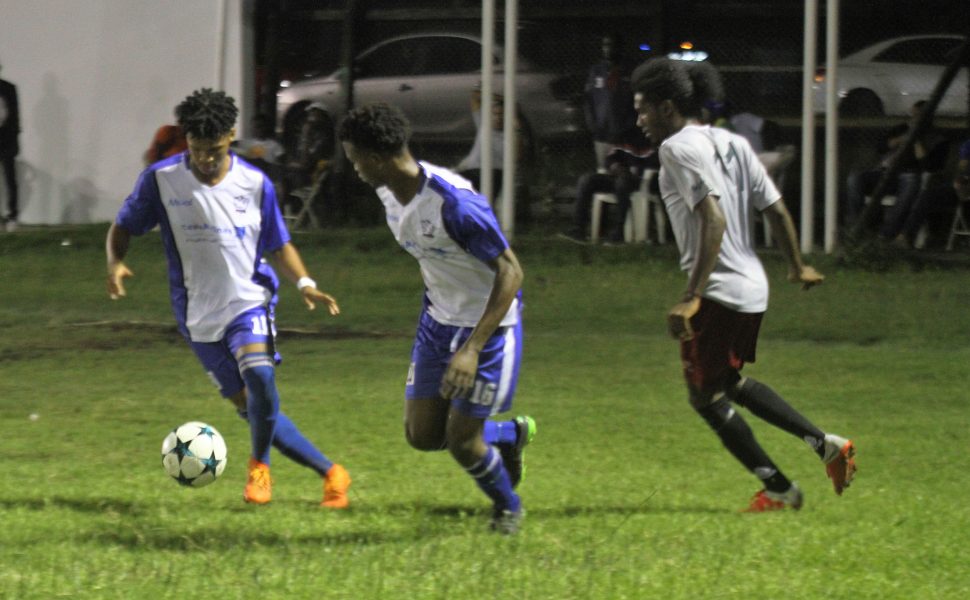 Action in the Turbo Knockout Football Championship finale between the Georgetown Football Club (in blue) and Northern Rangers at the Ministry of Education ground on Wednesday night. (Orlando Charles photo)
