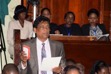 Charrandas Persaud when he took the oath as a MP in 2015.