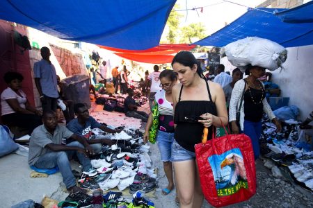 Cuban women shop at a street market
