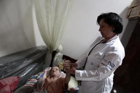 Cuban doctor Elisa Barrios Calzadilla inspects a patient during a house call in the city of Itiuba in the state of Bahia, northeastern Brazil. REUTERS/Ueslei Marcelino
