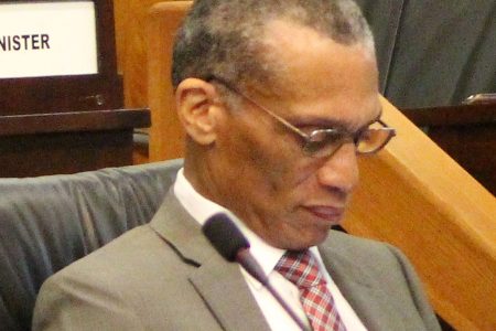 Foreign Affairs Minister Dennis Moses listens during debate at the sitting of the Senate.