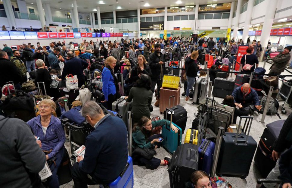 Passengers wait around in the South Terminal building at Gatwick Airport after drones flying illegally over the airfield forced the closure. (Reuters photo)
