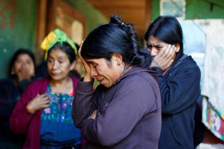 Catarina Alonzo (C), mother of Felipe Gomez Alonzo, a 8-year-old boy detained alongside his father for illegally entering the U.S., who fell ill and died in the custody of U.S. Customs and Border Protection (CBP), reacts at her home in the village of Yalambojoch, Guatemala December 27, 2018. REUTERS/Luis Echeverria