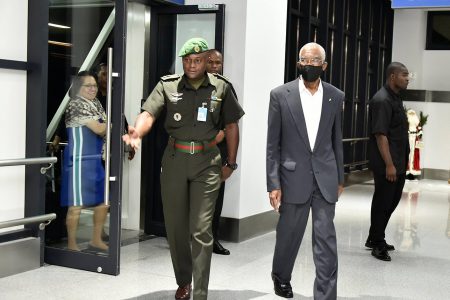 File photo: President David Granger (with face mask) after returning from Cuba in December 2018
