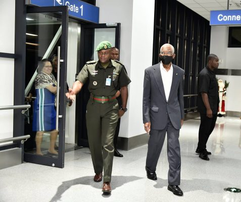 File photo: President David Granger (with face mask) after returning from Cuba in December 2018