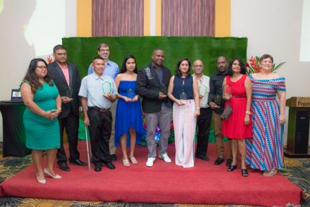 Director of the  Guyana Tourism Authority Brian Mullis (fourth from left) alongside this year’s GTA awardees and Acting-Chair GTA Board Andrea de Caires (right). (DPI photo)