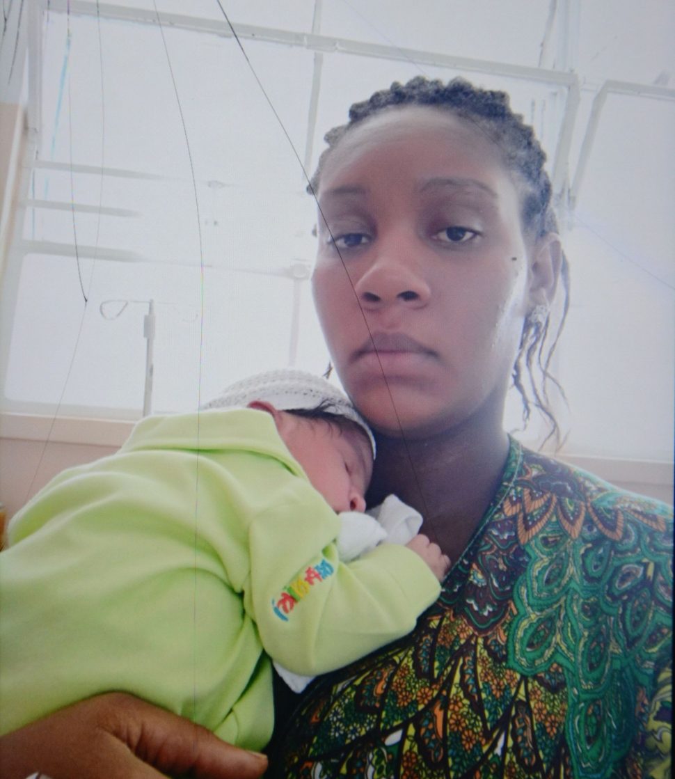 Maquader Martin, 26, with her first and only baby girl after giving birth at the San Fernando General Hospital.