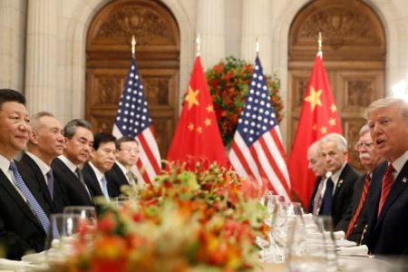 U.S. President Donald Trump, President Trump’s national security adviser John Bolton, President Trump’s trade and manufacturing policy adviser Peter Navarro and others, as well as Chinese President Xi Jinping’s leadership team attend a working dinner after the G20 leaders summit in Buenos Aires, Argentina, on Dec. 1, 2018. (Kevin Lamarque/Reuters)