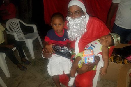 Santa and two of the children (DPI photo)