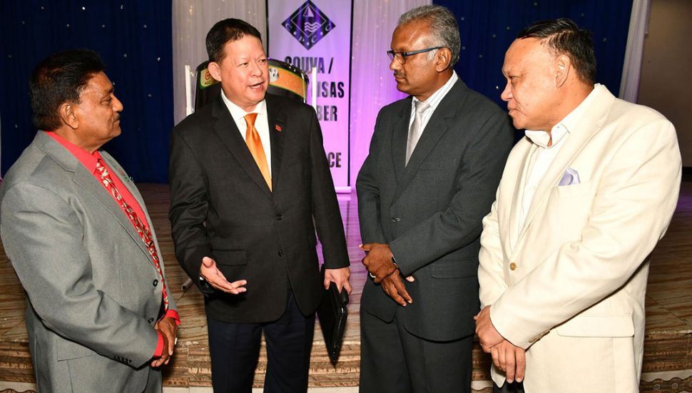 Dachin Group of Companies chairman Derek Chin, second from left, chats with, from left, Couva/Point Lisas Chamber of Commerce president Ramchand Rajbal Maraj, Couva South MP Rudy Indarsingh and Pointe-a-Pierre MP David Lee during the chamber’s Christmas Dinner on Wednesday. 
