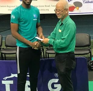 Guyanese Shemar Britton received his earnings after copping another T&T table tennis title
