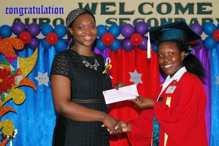 Top IT performer: Svetlana Dowding (right), a fifth former at the Aurora Secondary School, won the top prize in Information Technology at the 2018 Caribbean Secondary Examination Council (CSEC) for her school, a release from the Ministry of Public Telecommunications (MOPT) said. 
MOPT’s Training Co-ordinator, Donnella Collison (left), presented Svetlana with the gift of a Tablet, compliments of the Ministry, and took the opportunity to encourage her to pursue any of the Computer Sciences as she moves forward pursuing higher education.   
The Ministry of Public Telecommunications also presented a computer in November the Best Graduating Student in IT at the Corentyne Comprehensive High School. (MOPT photo)
