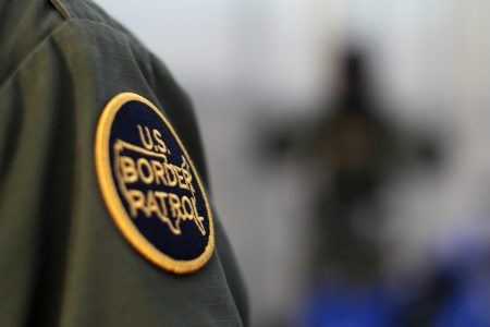 FILE PHOTO: A logo patch is shown on the uniform of a U.S. Border Patrol agent near the international border between Mexico and the United States south of San Diego, California March 26, 2013. REUTERS/Mike Blake
