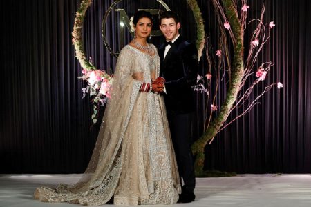 (Reuters). Bollywood actress Priyanka Chopra and her husband singer Nick Jonas arrive for a photo opportunity at their wedding reception in New Delhi