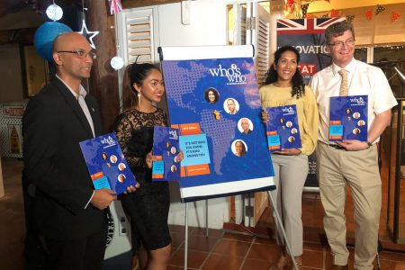 From left are ActionINVEST Caribbean Inc. head Vishnu Doerga, who created and produced the directory, along with its editor, Divya Doerga, Chairman of GO-Invest Patricia Bacchus and United Kingdom High Commissioner to Guyana Greg Quinn, who are holding copies at the launch on Thursday.