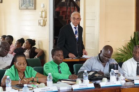 Minister of Communities Ronald Bulkan (standing) addresses the new Mayor and Councillors of Georgetown. (Photo by Terrence Thompson)