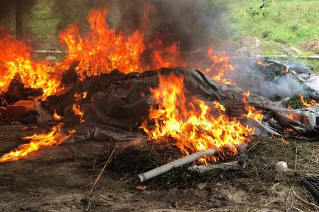 The processed cannabis and items from the camps being destroyed by fire
