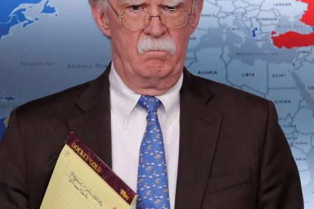 U.S. National Security Adviser John Bolton holds a pad of note paper with a note reading "5,000 troops to Colombia" as he waits to address reporters as the Trump administration announces economic sanctions against Venezuela and the Venezuelan state owned oil company Petroleos de Venezuela (PdVSA) during a press briefing at the White House in Washington, U.S., January 28, 2019. REUTERS/Jim Young