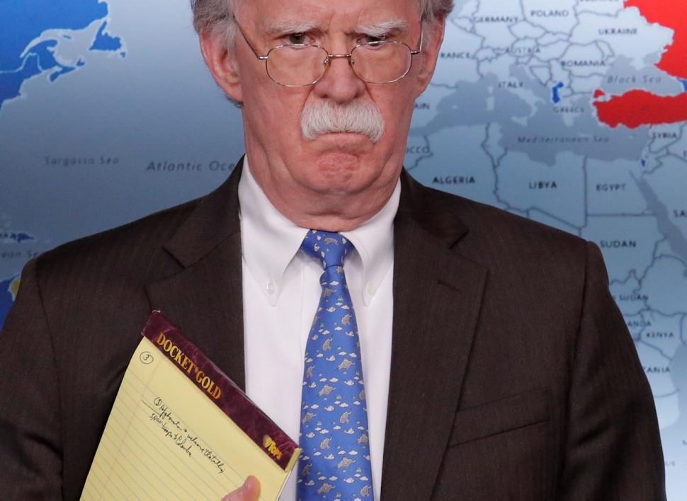 U.S. National Security Adviser John Bolton holds a pad of note paper with a note reading “5,000 troops to Colombia” as he waits to address reporters as the Trump administration announces economic sanctions against Venezuela and the Venezuelan state owned oil company Petroleos de Venezuela (PdVSA) during a press briefing at the White House in Washington, U.S., January 28, 2019. REUTERS/Jim Young