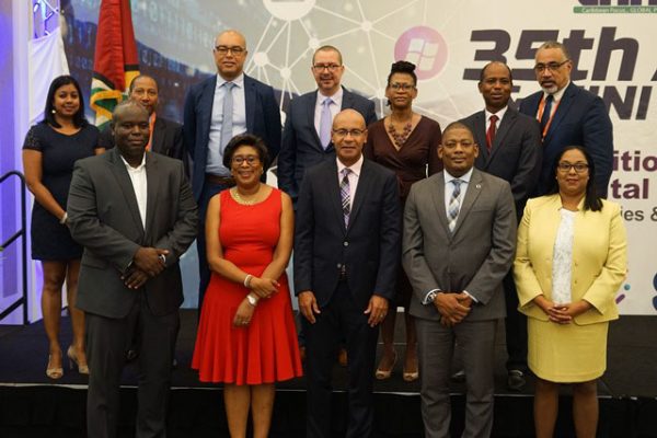 Minister of Public Telecommunications, Catherine Hughes (second from left in front row), outgoing Chairman of CANTO, Julian Wilkins (centre in front row), General Secretary of CANTO, Teresa Wankin (right) in front row), Suriname’s Minister of Public Works, Transportation and Communication, Patrick Pengel   (second from right in front row) and the Guyana Telephone and Telegraph Company (GTT) Chief Executive Officer, Justin Nedd (left) at the opening of  CANTO’s 35th Annual General Meeting.  (DPI photo)
