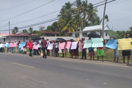 Corentyne residents picketing the GWI office