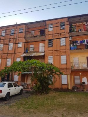 The building at Maloney Gardens where an 11 year old autistic girl allegedly fell from the top floor yesterday. Police were up to last night probing the circumstances under which she fell.