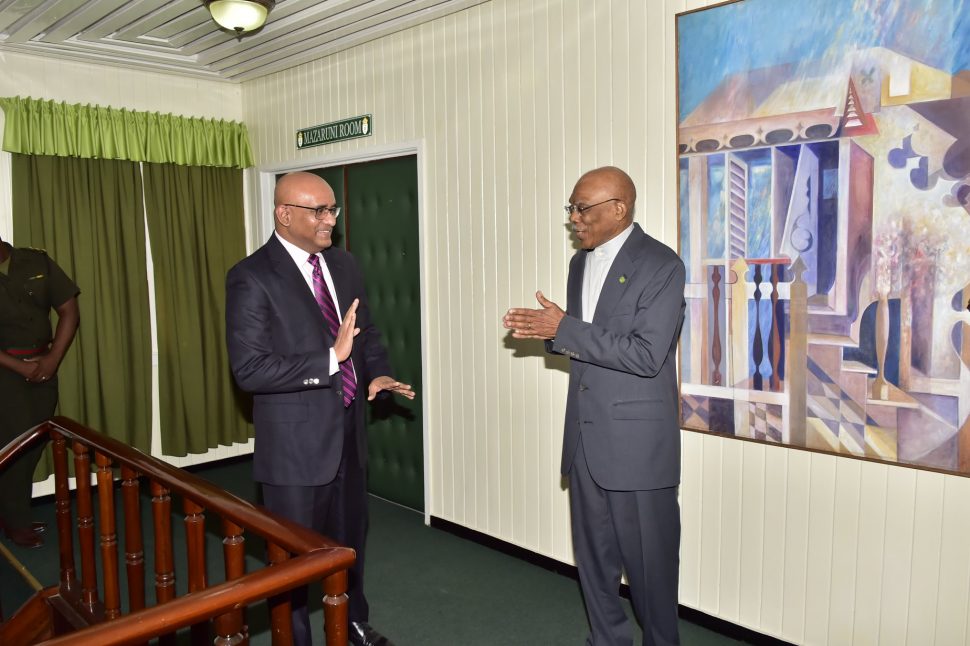 President David Granger (right) and Opposition Leader Bharrat Jagdeo in conversation.