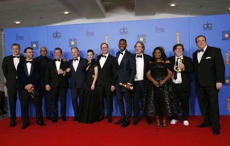 The cast and crew of "Green Book" pose backstage with their Best Motion Picture - Musical or Comedy award REUTERS/Mario Anzuoni
