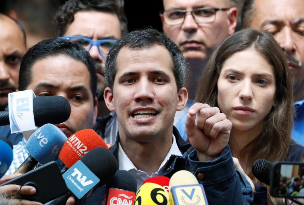Venezuelan opposition leader and self-proclaimed interim president Juan Guaido accompanied by his wife Fabiana Rosales, speaks to the media after a holy mass in Caracas, Venezuela, January 27, 2019. REUTERS/Carlos Garcia Rawlins